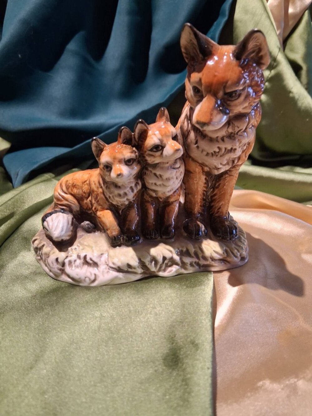 Vintage ceramic glaze fox family figurine depicting a fox family.